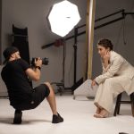 Photographer Taking Pictures of a Woman in a Studio